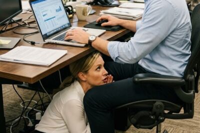 My Boss Crawled Under My Desk And Whispered, “Act Natural. Just Keep Working.”